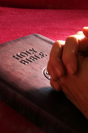 Bible folded hands